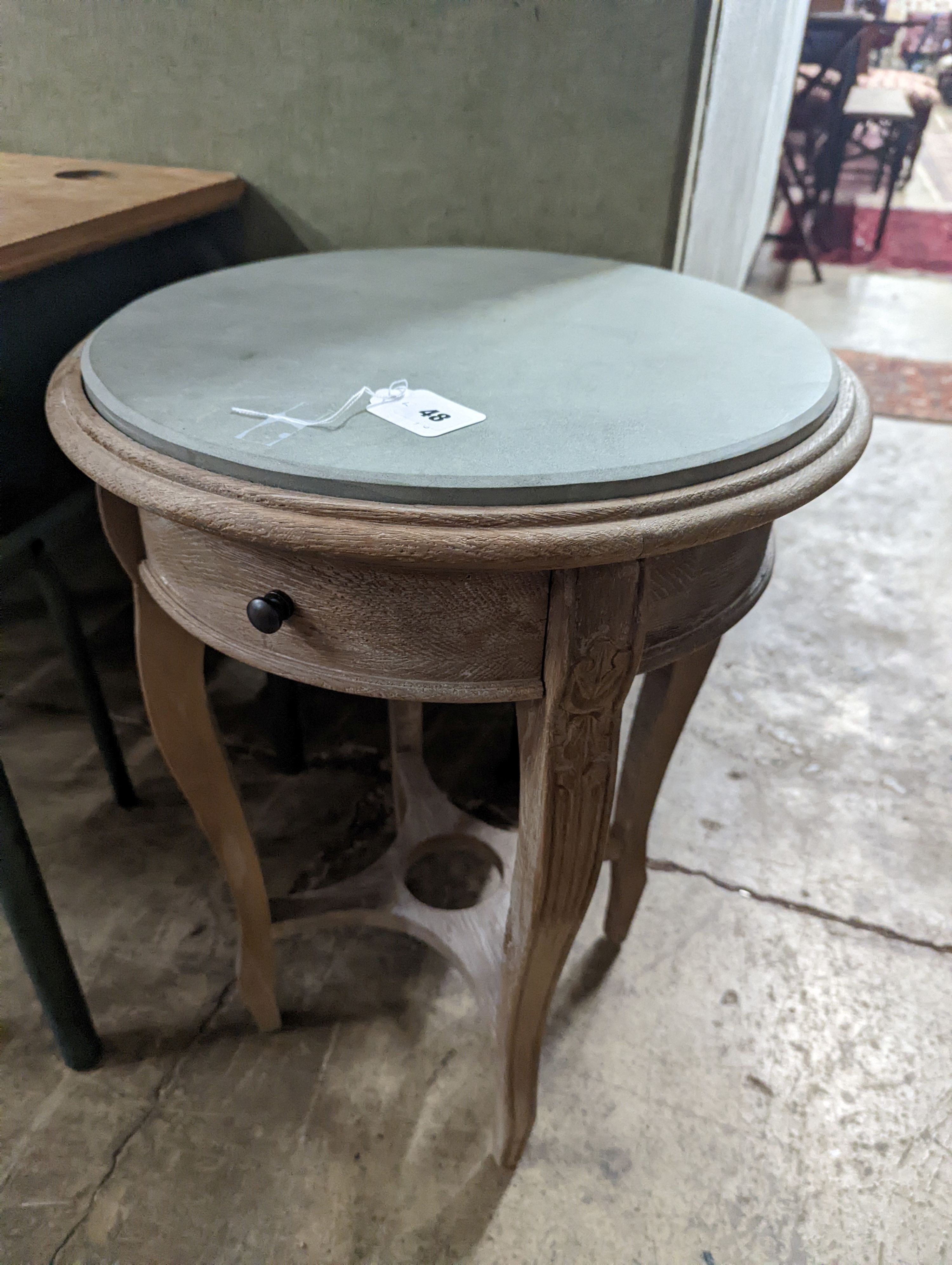 A pair of circular bleached oak occasional tables, stone inset tops, diameter 44cm, height 60cm